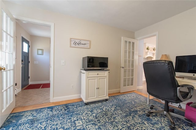 home office with french doors and baseboards