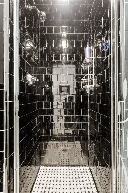 bathroom with tiled shower