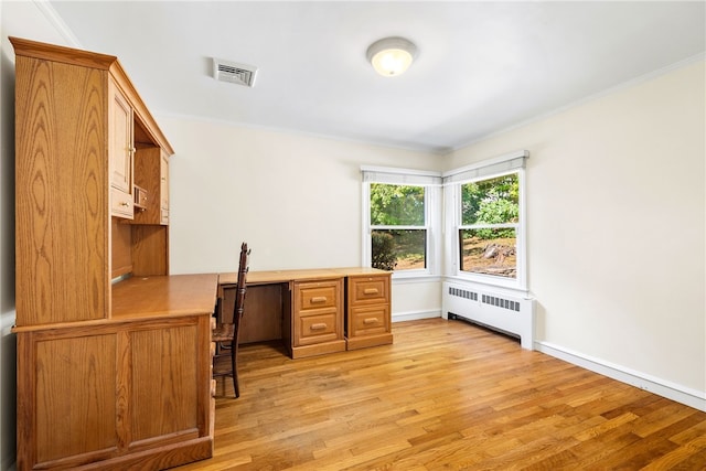 office with visible vents, light wood-style floors, radiator heating unit, and crown molding