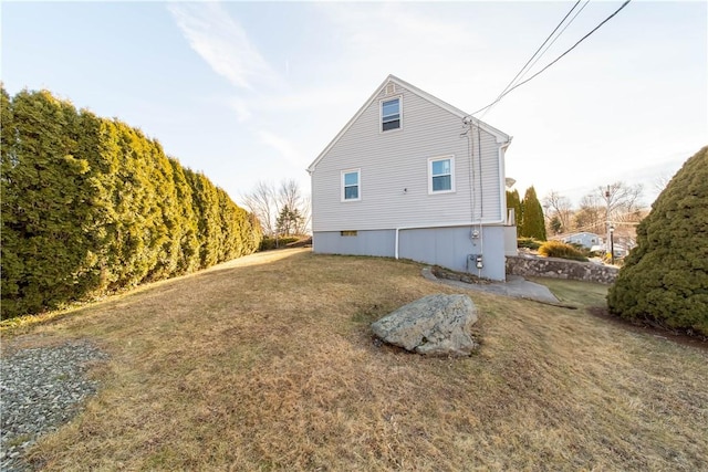 view of property exterior featuring a yard