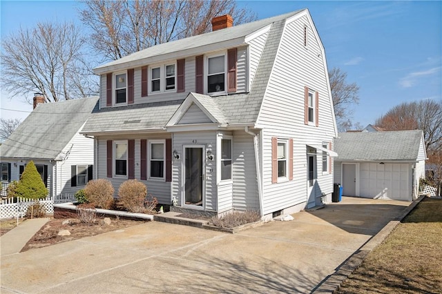 dutch colonial featuring fence, driveway, a gambrel roof, a chimney, and an outdoor structure