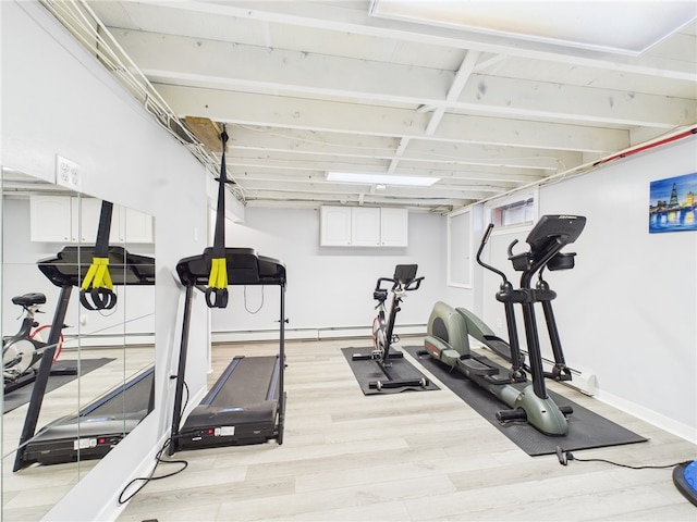 workout area featuring light wood finished floors