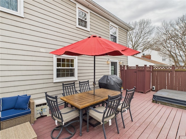 deck featuring area for grilling and outdoor dining space