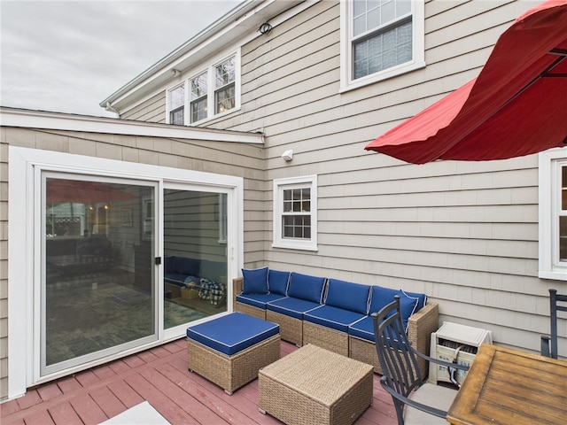 wooden terrace featuring outdoor lounge area