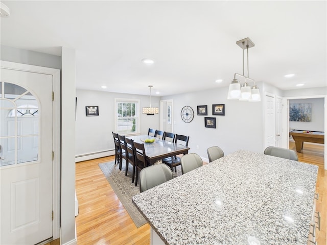 dining room with recessed lighting, baseboards, light wood finished floors, and a baseboard radiator