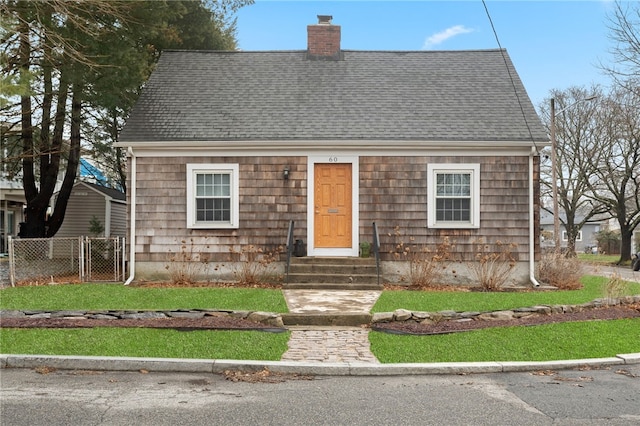 cape cod-style house with a gate, fence, roof with shingles, a chimney, and entry steps