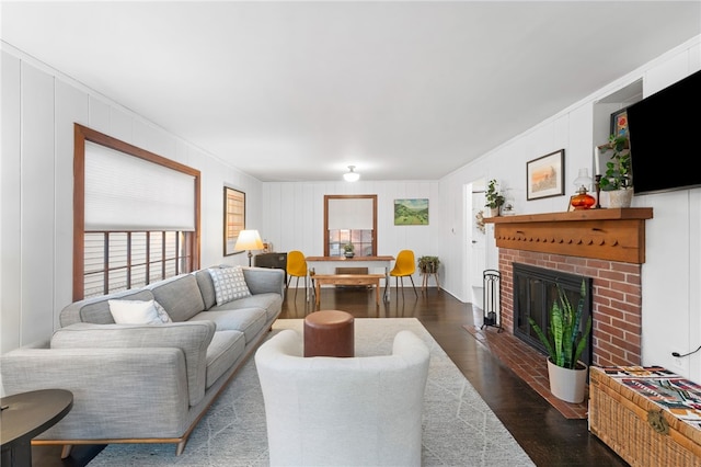 living area with a fireplace and wood finished floors