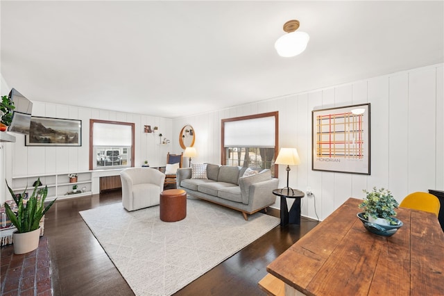 living area with plenty of natural light and wood finished floors