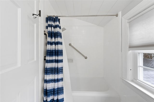 bathroom featuring lofted ceiling