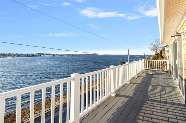 wooden terrace with a water view