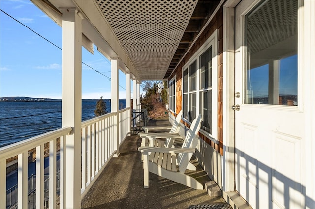 balcony featuring a water view