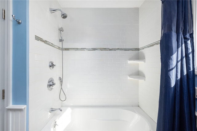 bathroom featuring shower / bathtub combination with curtain