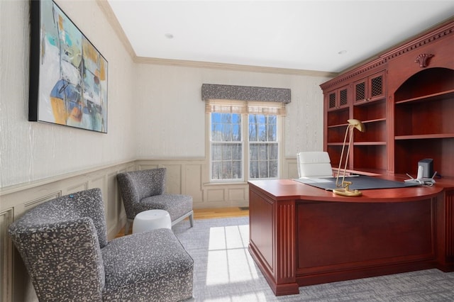 office area with a wainscoted wall and ornamental molding