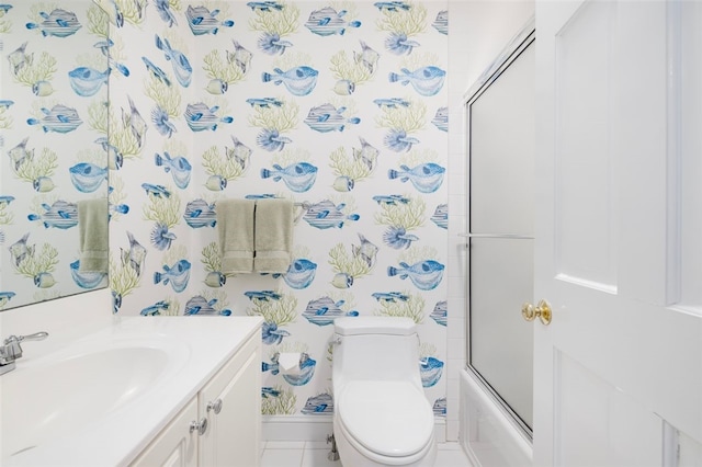 bathroom with wallpapered walls, baseboards, toilet, combined bath / shower with glass door, and vanity