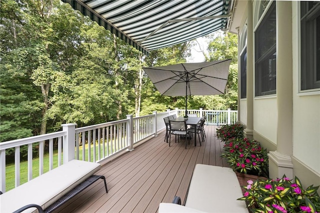 deck featuring outdoor dining area