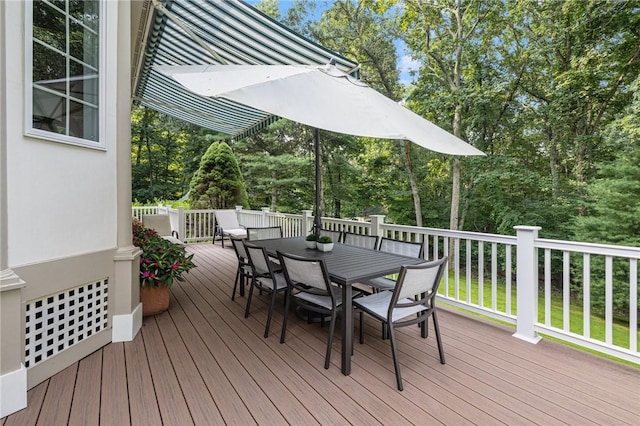 deck featuring outdoor dining area