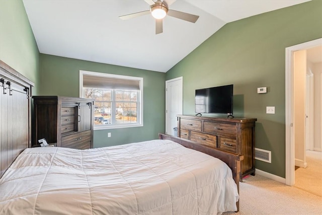 carpeted bedroom with baseboards, lofted ceiling, visible vents, and a ceiling fan