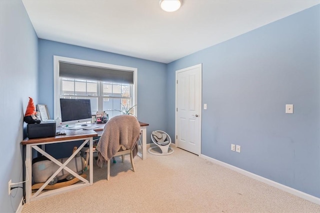 office featuring baseboards and carpet floors