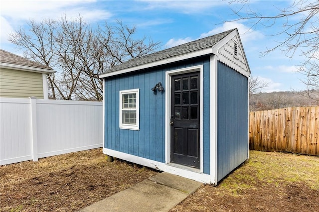 view of shed featuring a fenced backyard