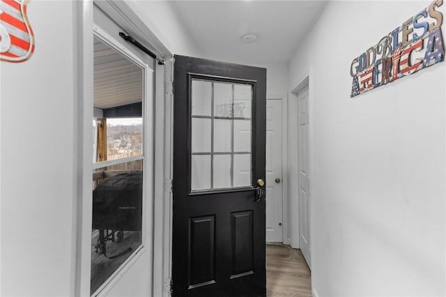 doorway to outside featuring wood finished floors