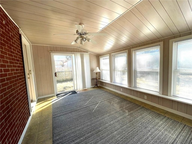 unfurnished sunroom featuring plenty of natural light and wood ceiling