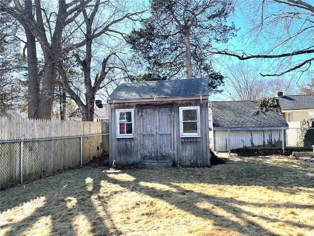 view of shed with a fenced backyard