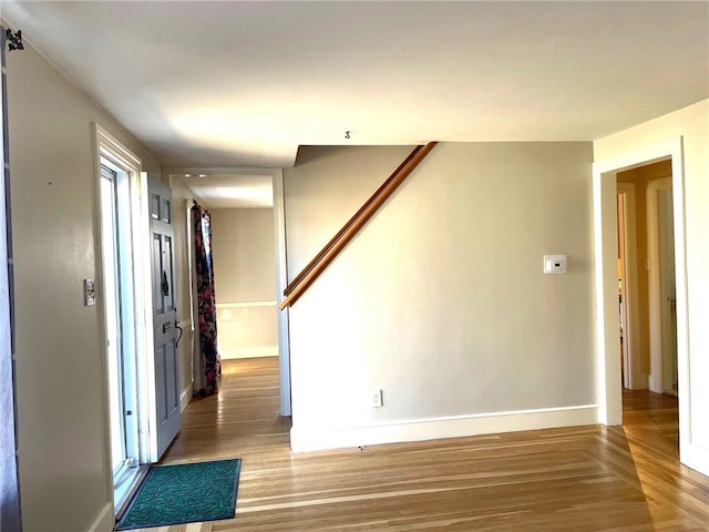 entrance foyer with parquet flooring and baseboards