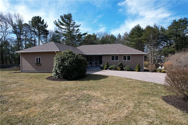 ranch-style home with a front lawn