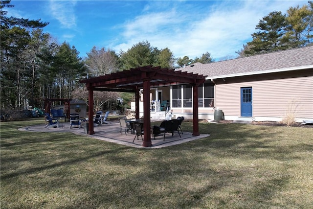 exterior space featuring a yard, a patio, and a pergola