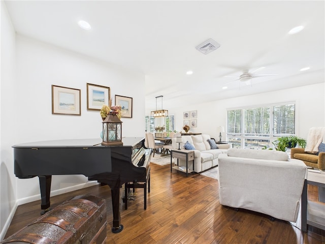 living area featuring visible vents, a ceiling fan, dark wood finished floors, recessed lighting, and baseboards