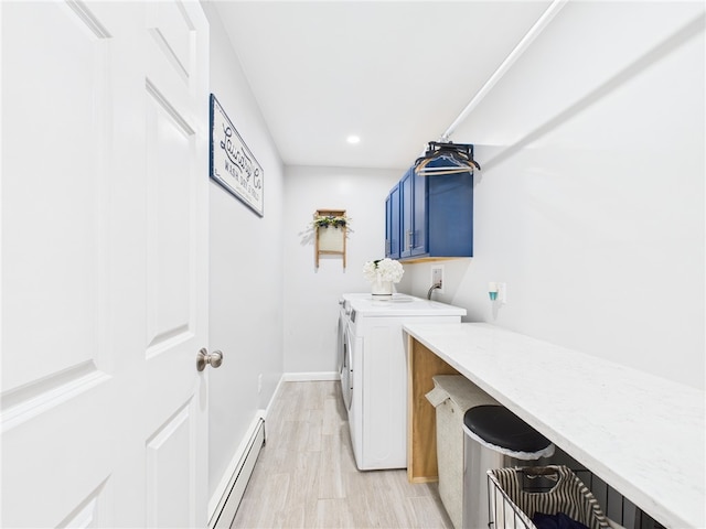 laundry room featuring baseboards, separate washer and dryer, cabinet space, a baseboard heating unit, and light wood-type flooring