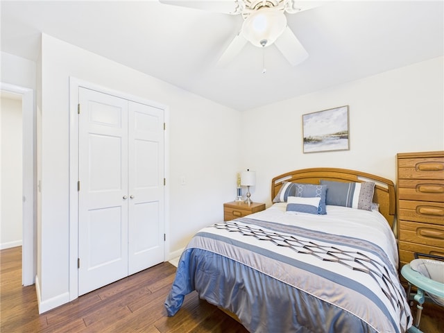 bedroom featuring ceiling fan, a closet, baseboards, and wood finished floors