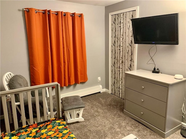 carpeted bedroom featuring baseboards and baseboard heating