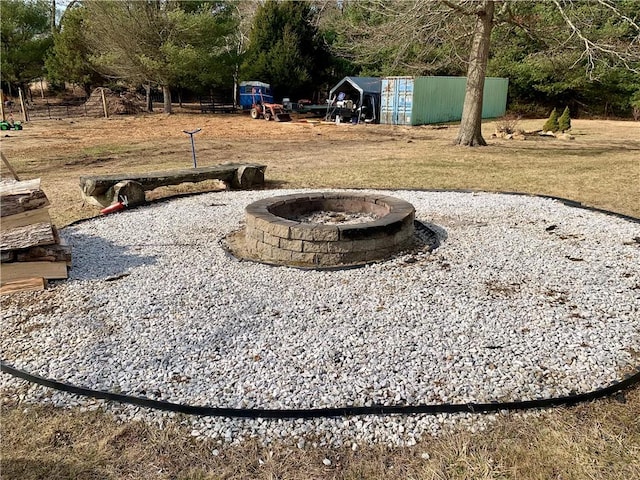 view of yard featuring a fire pit