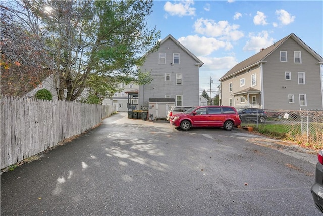 view of parking featuring fence