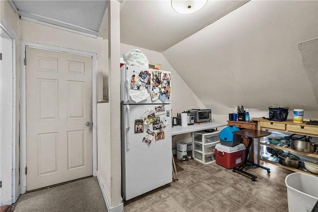 office area with vaulted ceiling