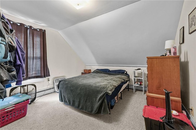 bedroom featuring baseboard heating, lofted ceiling, and carpet floors