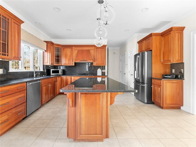 kitchen with a kitchen island, light tile patterned floors, appliances with stainless steel finishes, custom exhaust hood, and a sink