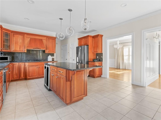 kitchen featuring a kitchen island, premium range hood, decorative backsplash, light tile patterned flooring, and stainless steel appliances