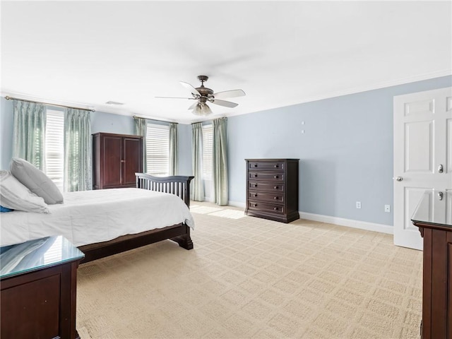 bedroom with baseboards, light carpet, and a ceiling fan