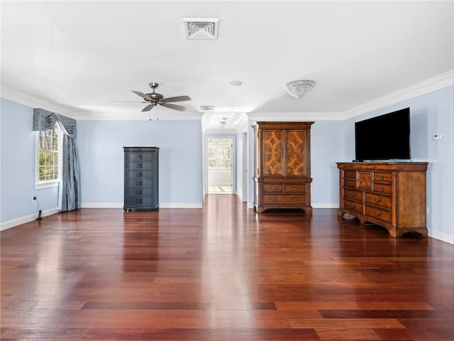 unfurnished living room with visible vents, wood finished floors, crown molding, baseboards, and ceiling fan