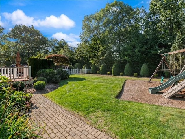 view of yard with fence and a playground