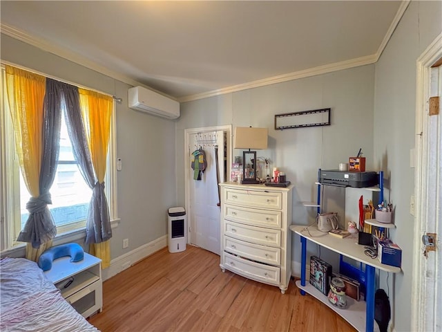 bedroom with light wood-style flooring, a wall mounted AC, baseboards, and ornamental molding