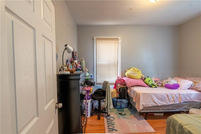 bedroom featuring light wood-style flooring