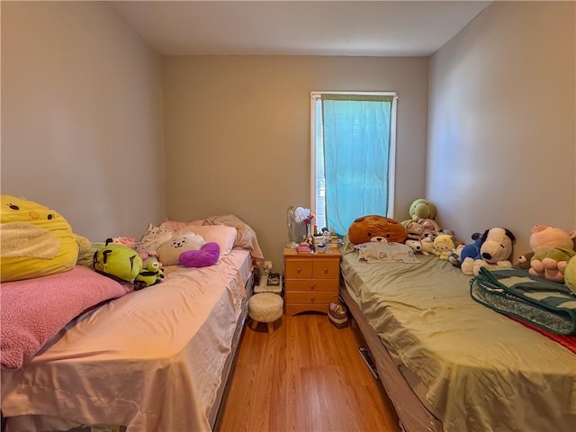 bedroom with light wood-style floors