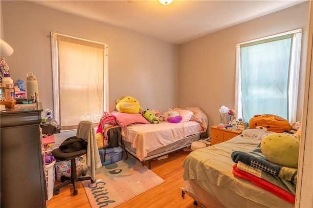 bedroom featuring light wood-style floors