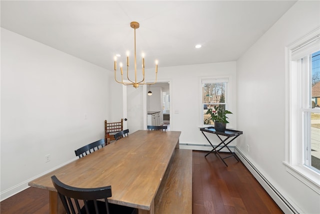 dining room featuring a baseboard heating unit, baseboards, dark wood finished floors, a chandelier, and recessed lighting