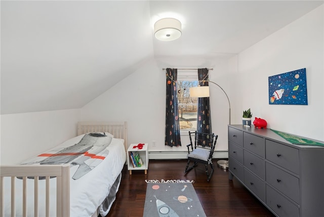 bedroom with lofted ceiling and wood finished floors