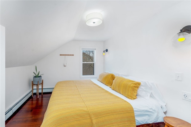 bedroom featuring a baseboard heating unit, dark wood-type flooring, and vaulted ceiling