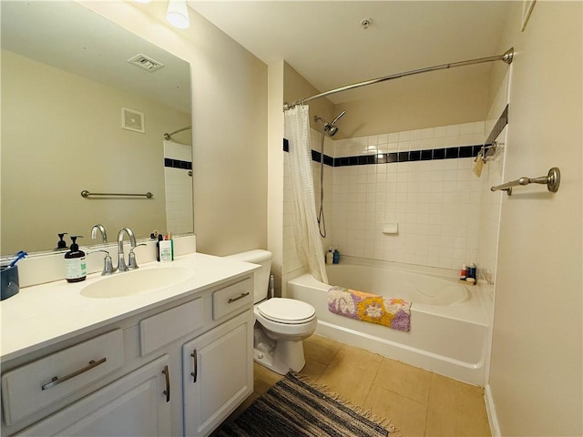 bathroom with visible vents, vanity, toilet, and shower / tub combo